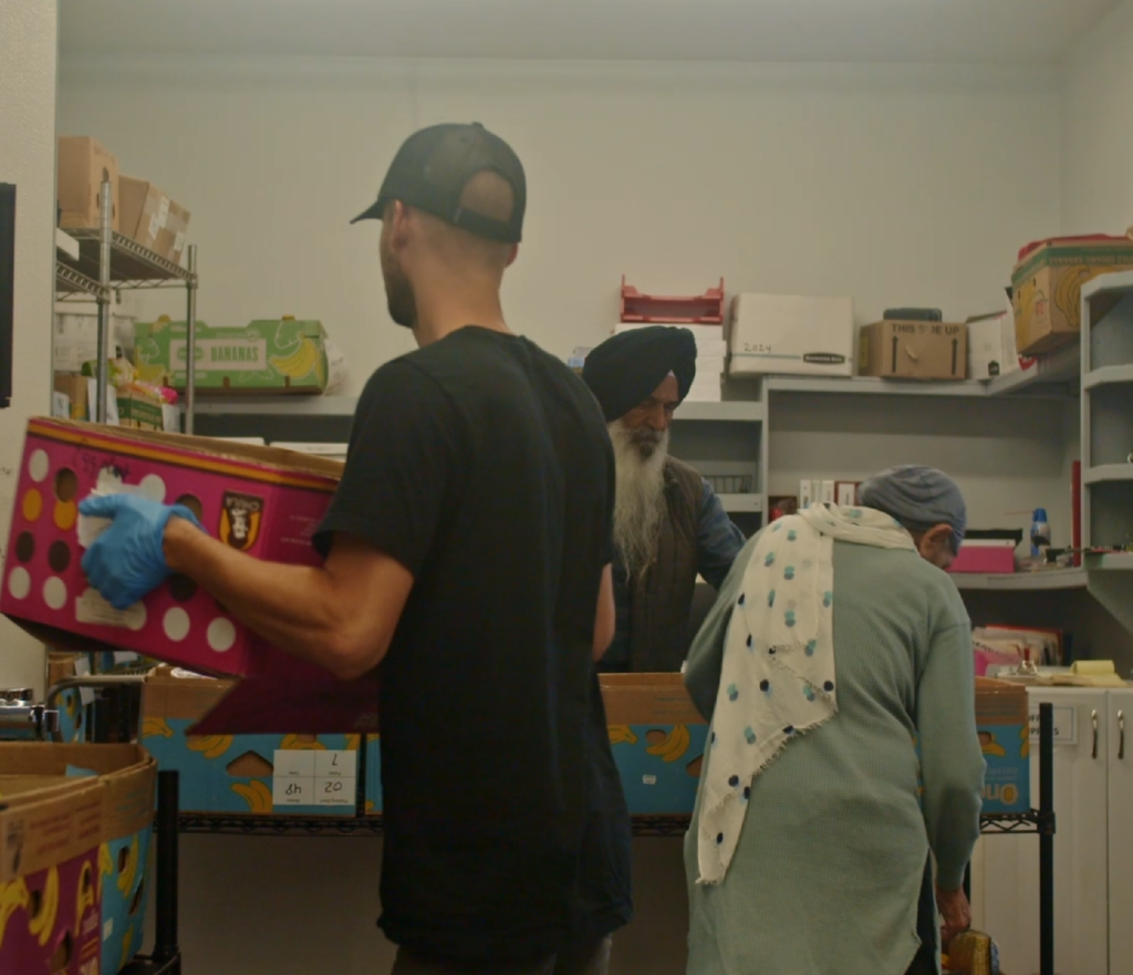 Volunteers and Staff sorting grocery rescue food